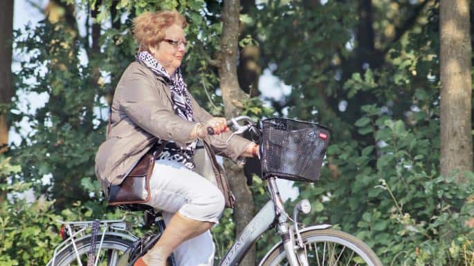 Easy E-Biking - senior woman riding e-bike, helping to make electric biking practical and fun