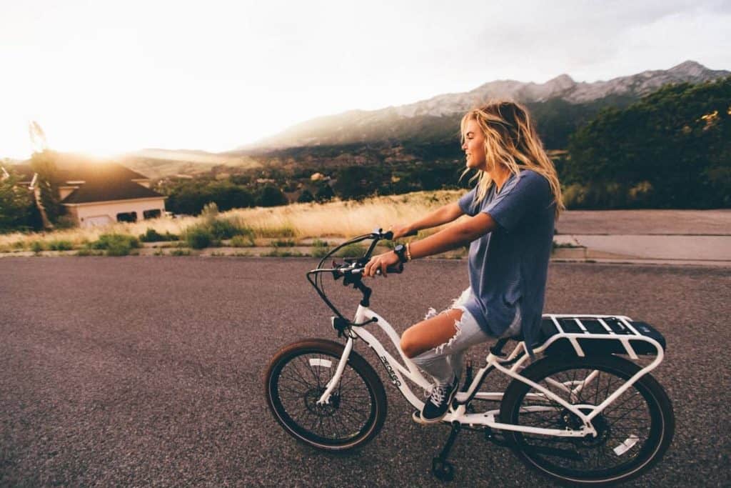 Easy E-Biking - woman riding e-bike nature, helping to make electric biking practical and fun