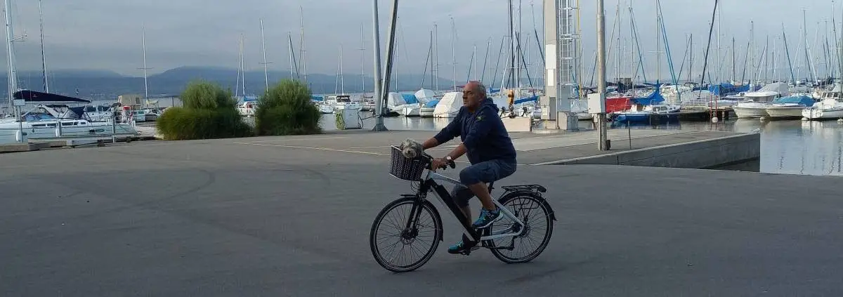 Easy E-Biking - man riding e-bike lake, helping to make electric biking practical and fun