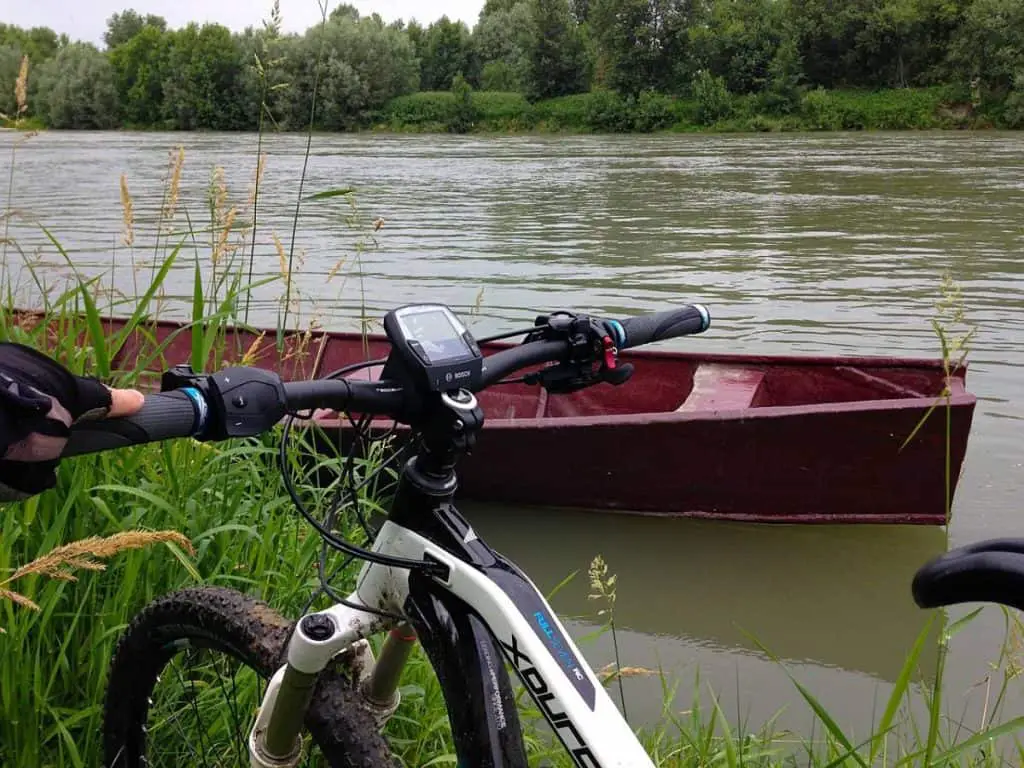 Easy E-Biking - e-bike parked nature river, helping to make electric biking practical and fun