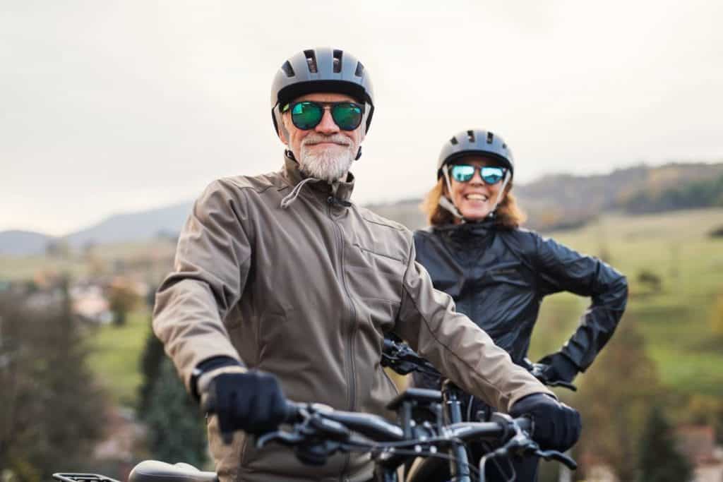 Easy E-Biking - senior couple riding e-bikes, helping to make electric biking practical and fun