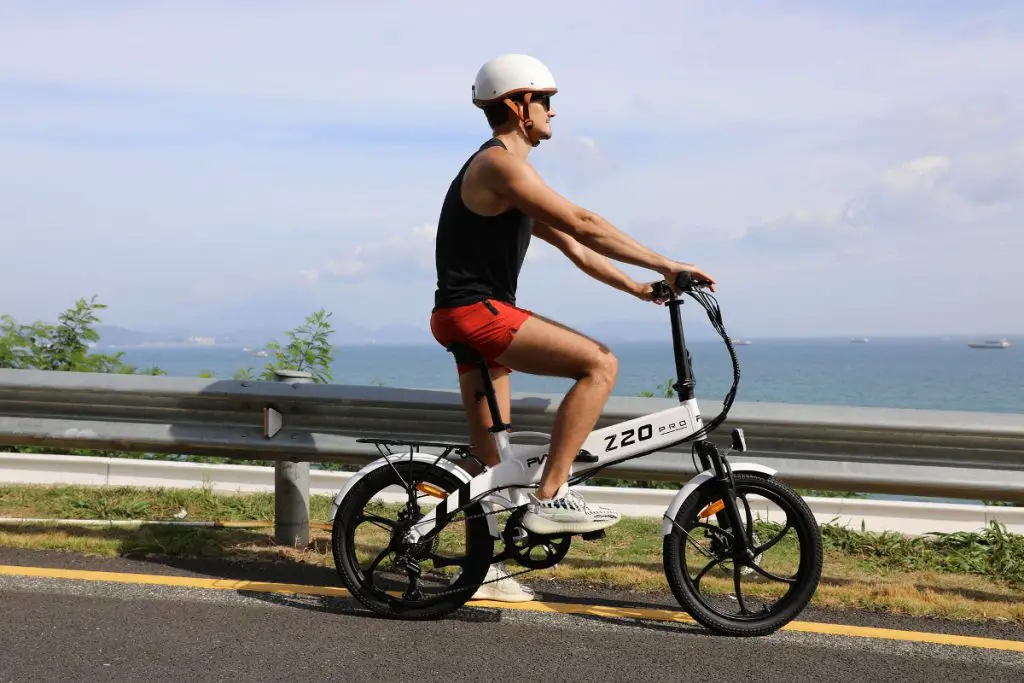 Easy E-Biking - PVY Z20 Pro e-bike, man, seaside road, helping to make electric biking practical and fun