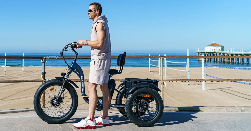 Easy E-Biking - Addmotor Grandtan e-bike, man sea side, helping to make electric biking practical and fun